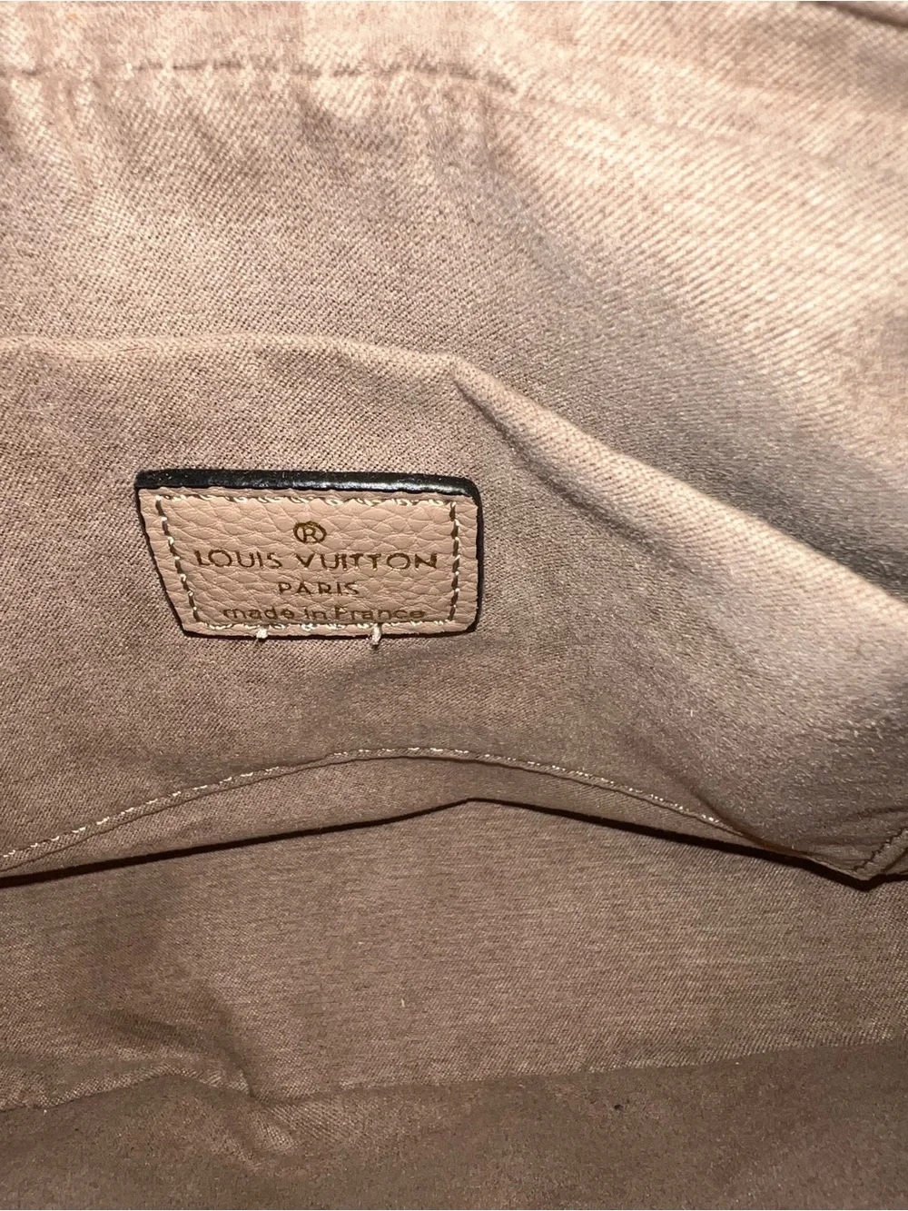 Designer inspired half-moon shoulder bag in a neutral taupe leather w/monogram
